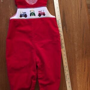 Toddler size2 Red Christmas overalls with Smocked Tractors.